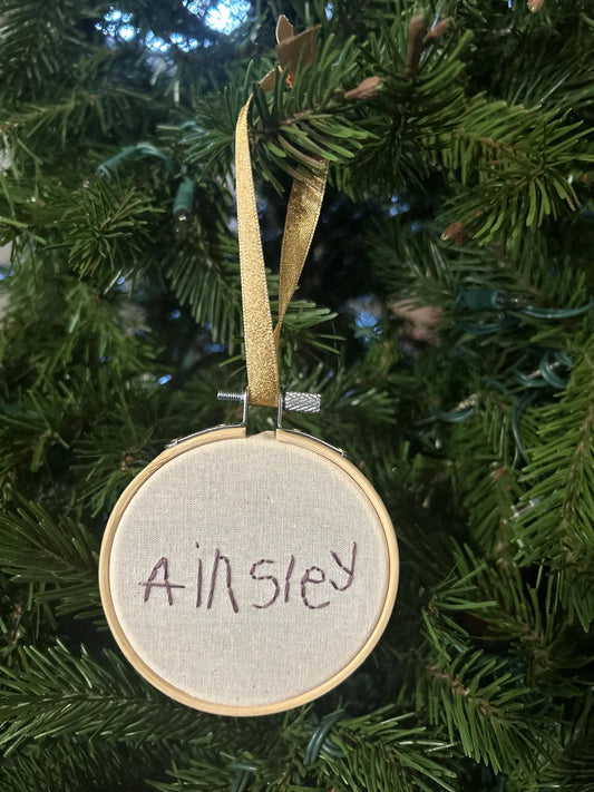 Ainsley child’s handwritten name custom embroidered ornament on Christmas Tree