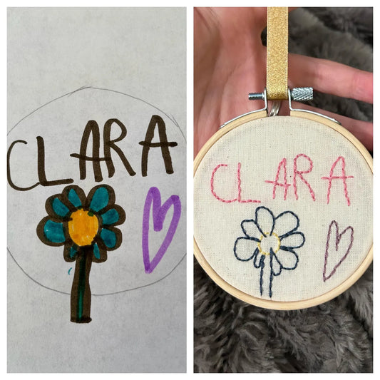 child’s drawing with heart and flower embroidered hoop