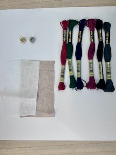 Embroidery floss, fabric, and grommets