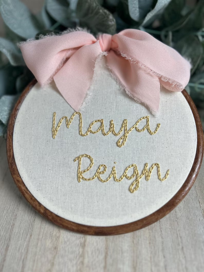 baby’s name with pink bow embroidered hoop
